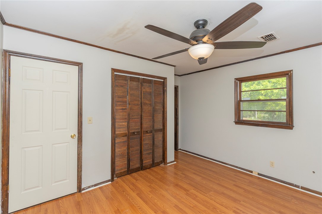 820 Travis Road Anderson, SC 29626 - Photo 35 of 46 This inviting bedroom features rich hardwood flooring and a stylish ceiling fan for ultimate comfort.