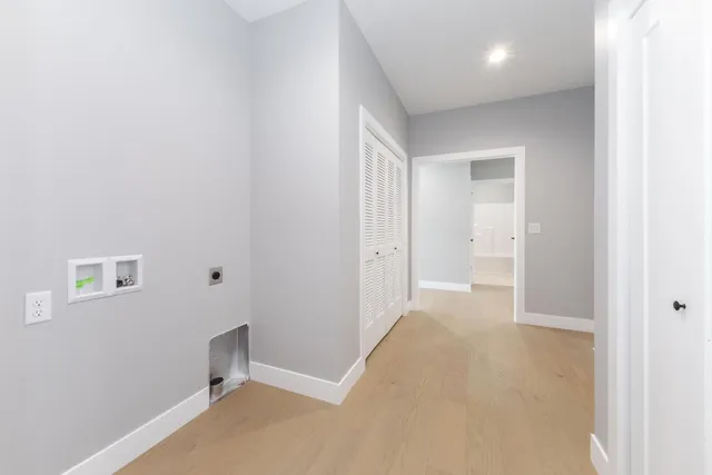 a view of a kitchen and a window in the room