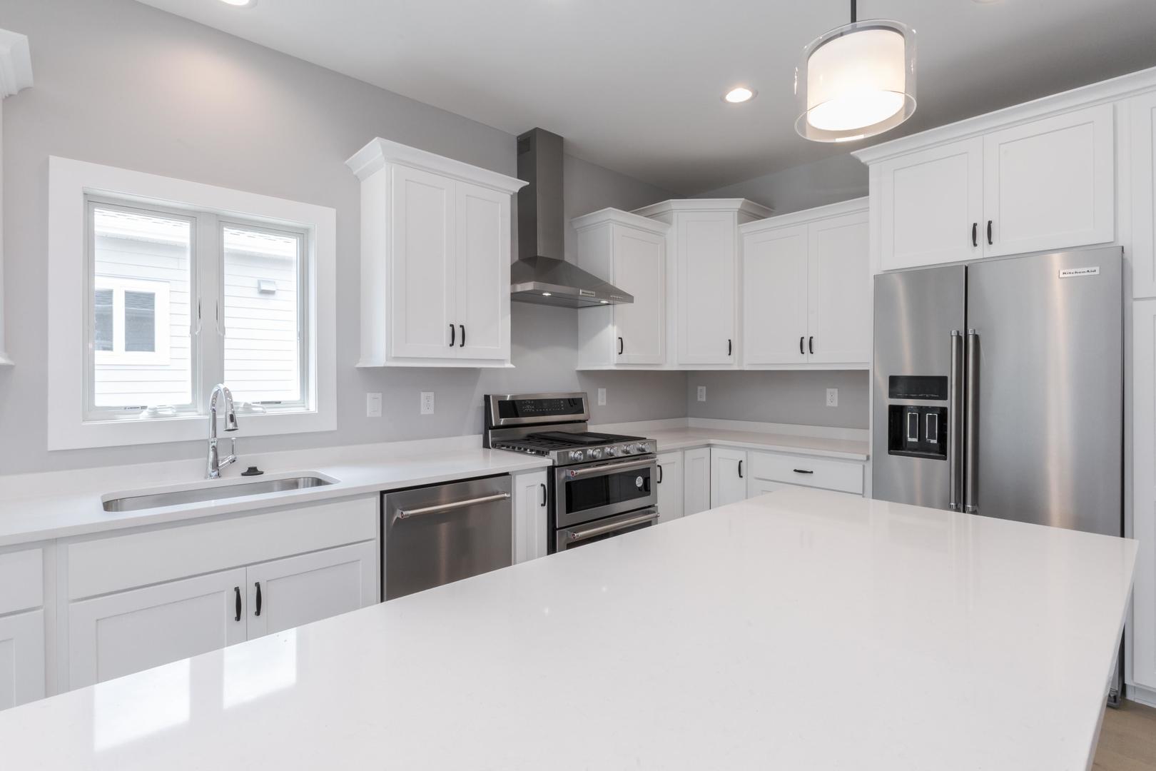 520 South 6th Street Fairbury, IL 61739 - Photo 18 of 42 a kitchen with stainless steel appliances a sink stove and refrigerator