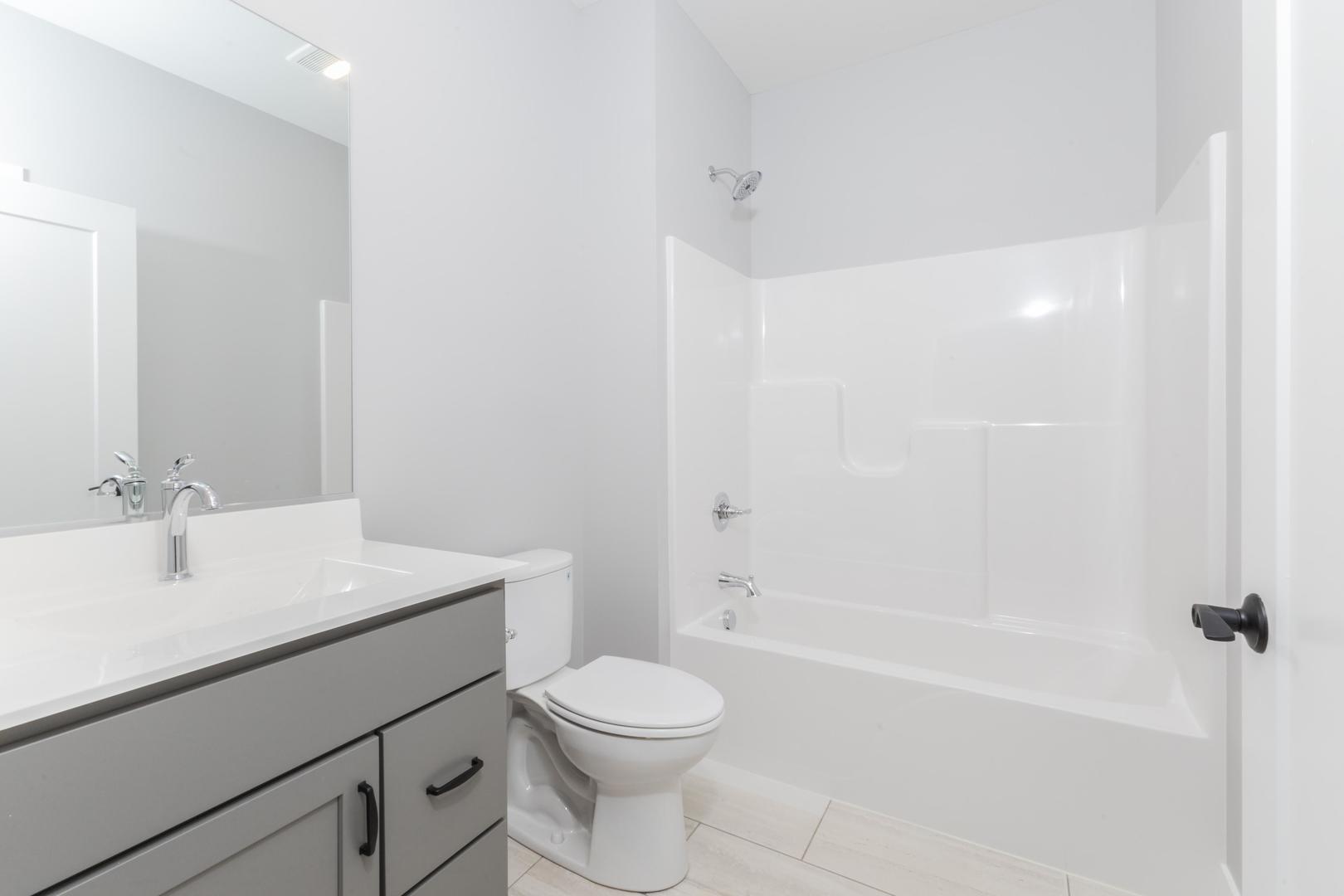 520 South 6th Street Fairbury, IL 61739 - Photo 10 of 42 a bathroom with a sink a toilet and shower