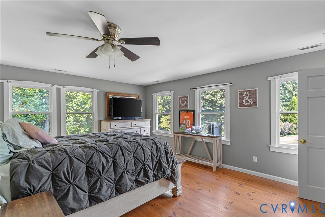 80 Mill Ridge Road Hartfield, VA 23071 - Photo 27 of 43 Hardwood-finish flooring, multiple windows, ceilin