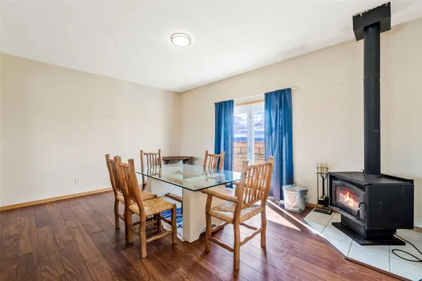 a view of a dining room with furniture and a fireplace
