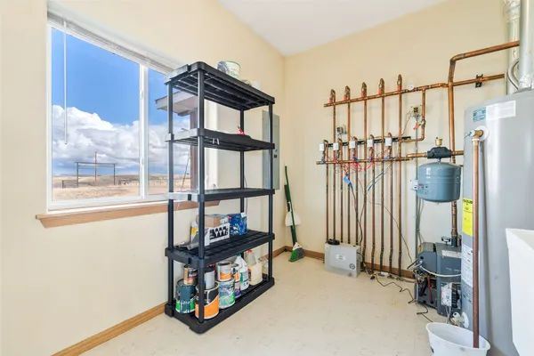a bedroom with furniture and a window