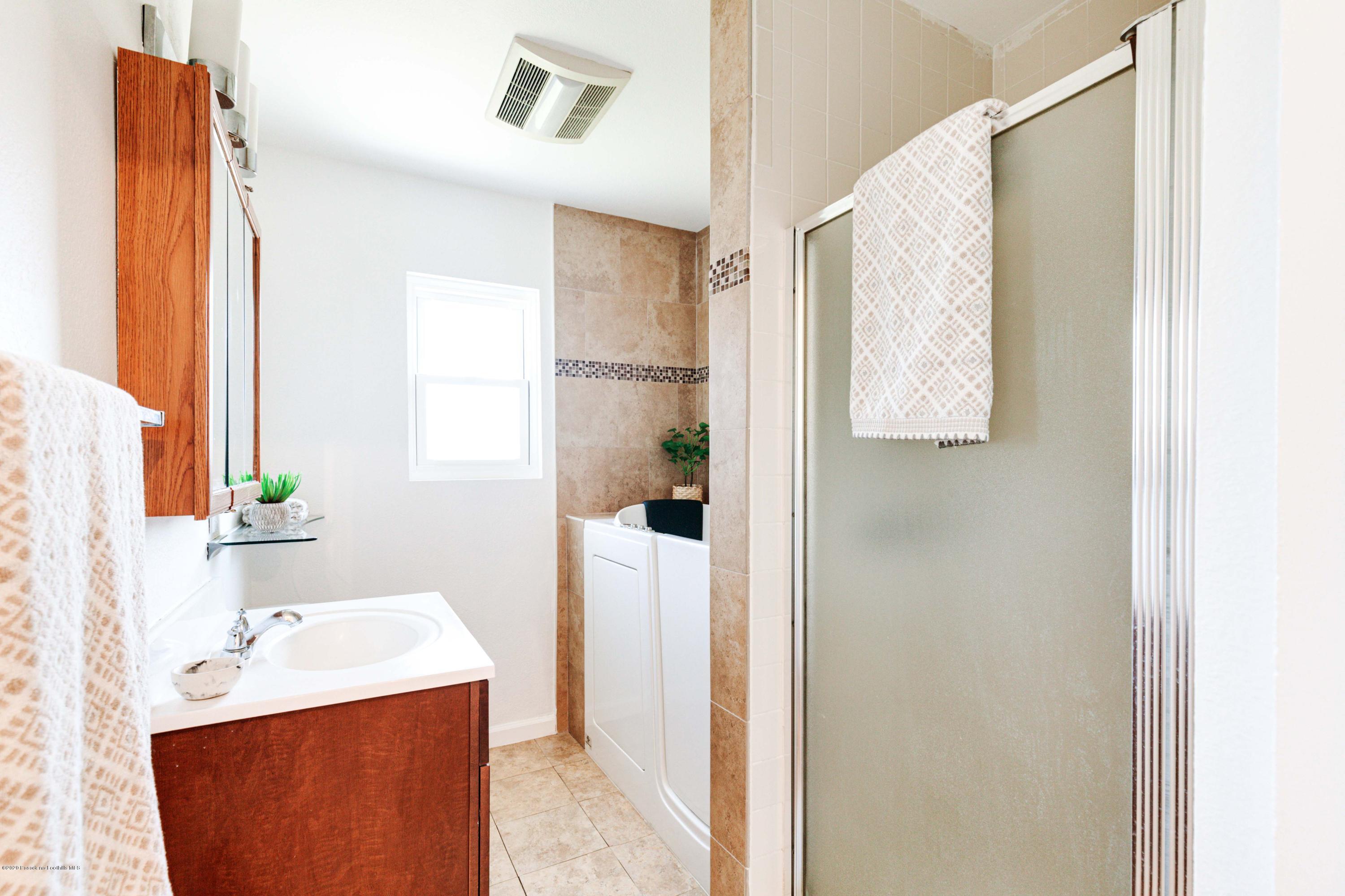58 Mountain View Street Altadena, CA 91001 - Photo 12 of 30 a bathroom with a sink toilet and shower