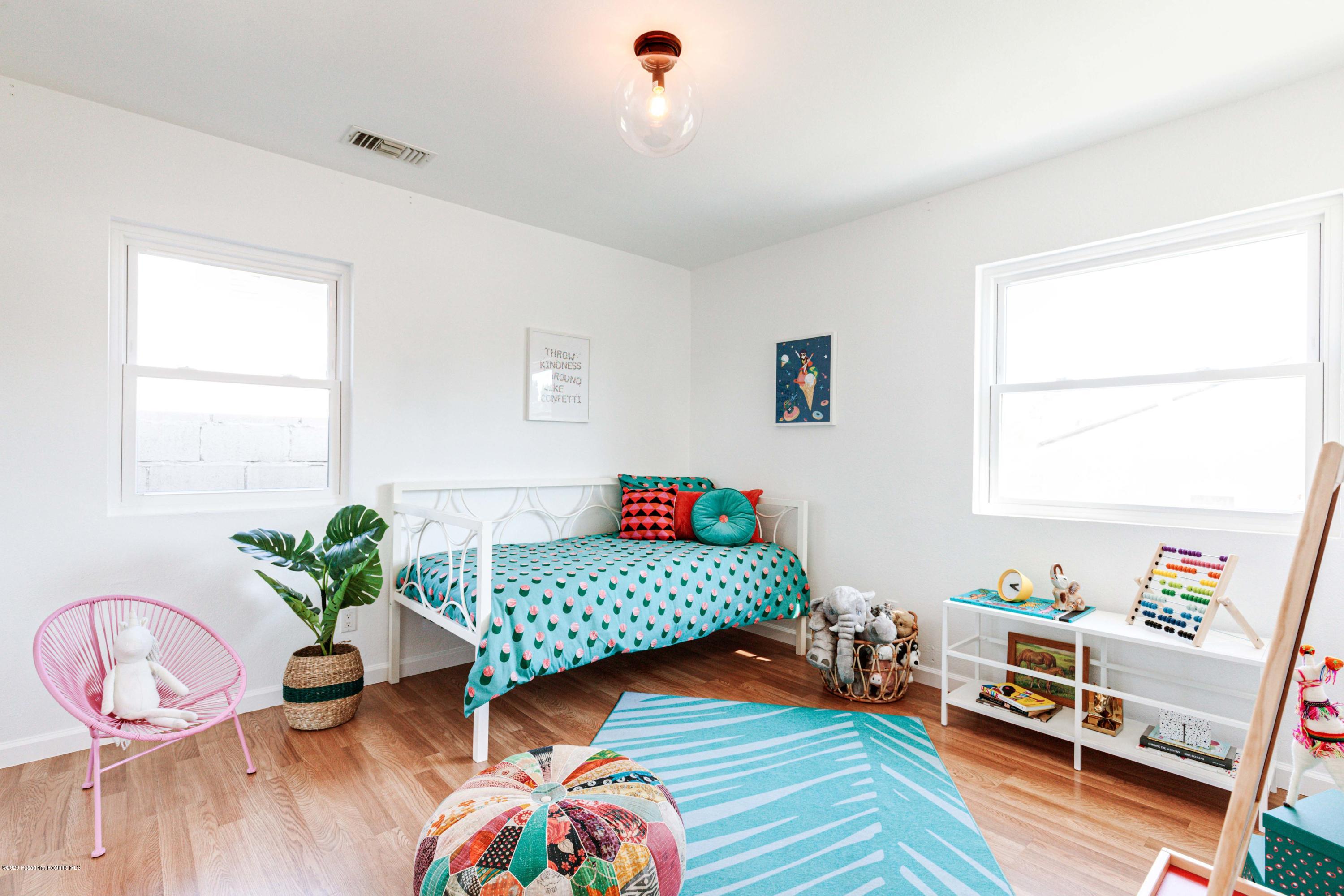 58 Mountain View Street Altadena, CA 91001 - Photo 13 of 30 a bedroom with furniture and a potted plant