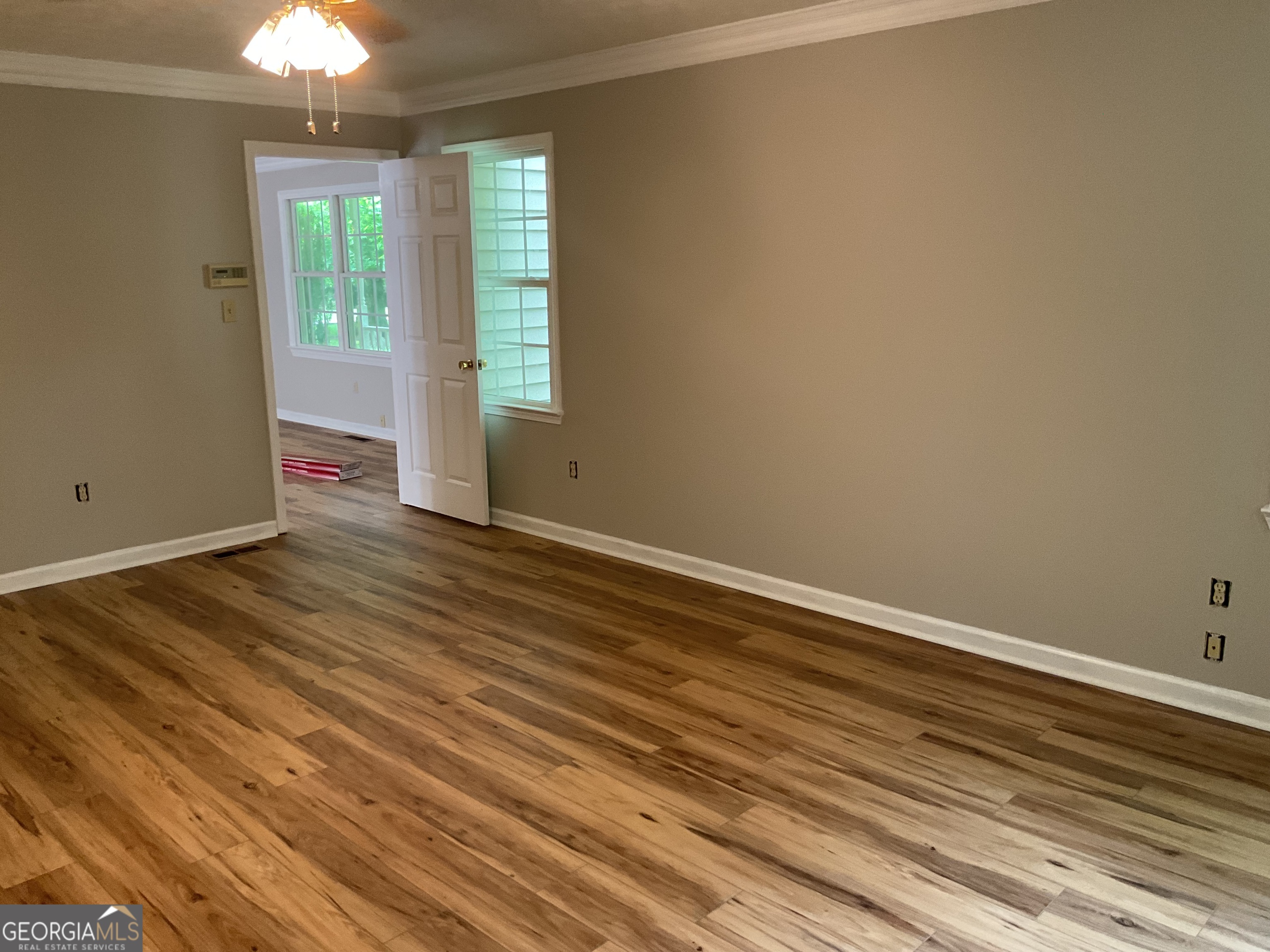 4800 Bethlehem Road Fairburn, GA 30213 - Photo 27 of 49 an empty room with wooden floor and windows