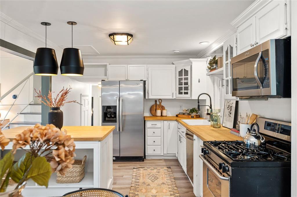 3059 Trafalgar Way Atlanta, GA 30341 - Photo 11 of 52 a kitchen with stainless steel appliances granite countertop a stove a sink and a microwave