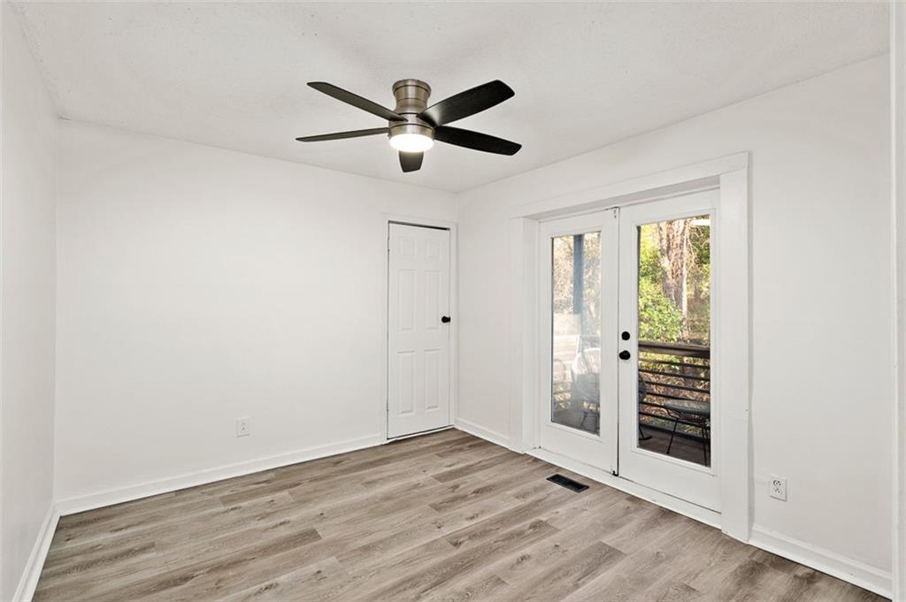 3059 Trafalgar Way Atlanta, GA 30341 - Photo 18 of 52 a view of empty room with wooden floor and window