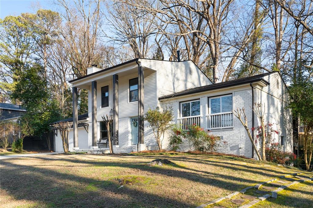 3059 Trafalgar Way Atlanta, GA 30341 - Photo 2 of 52 front view of a house with a small yard