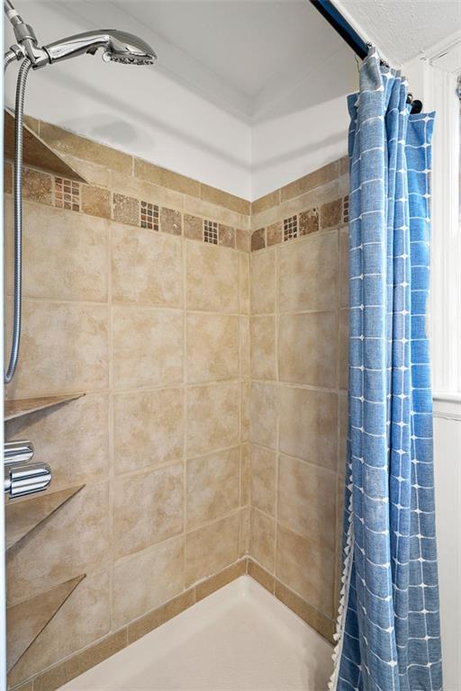 3059 Trafalgar Way Atlanta, GA 30341 - Photo 21 of 52 a bathroom with a shower and a glass door