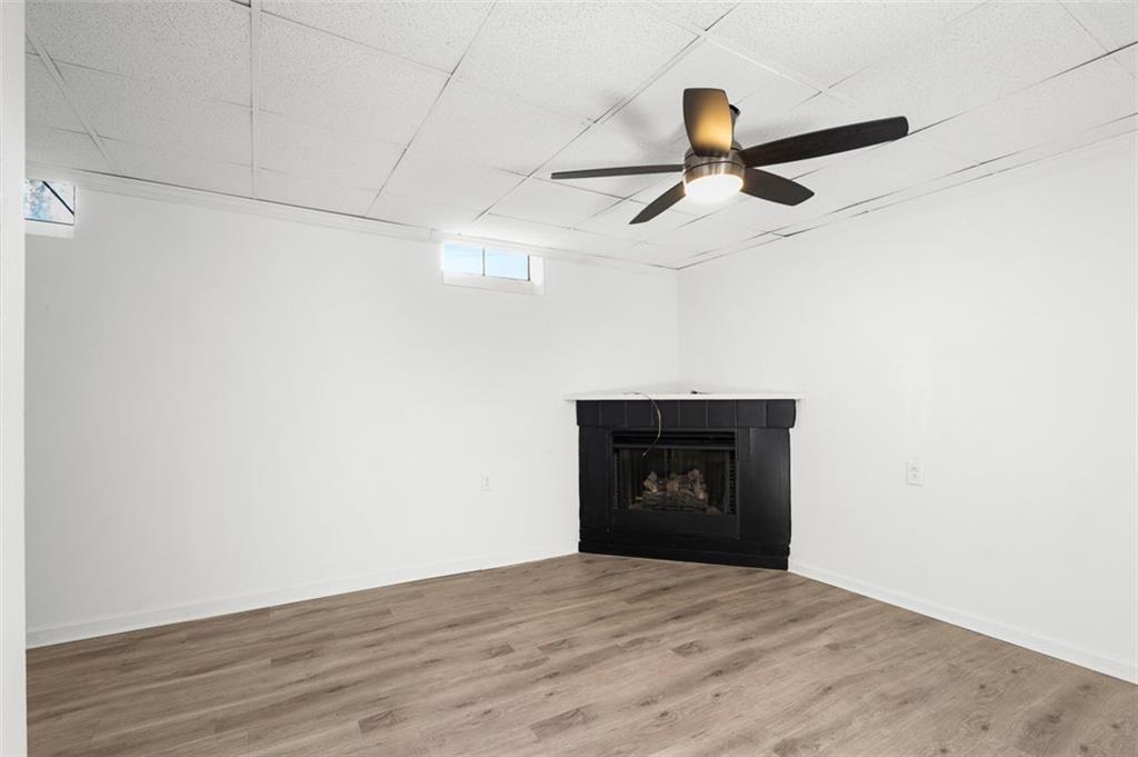 3059 Trafalgar Way Atlanta, GA 30341 - Photo 23 of 52 a view of empty room with a fireplace and wooden floor