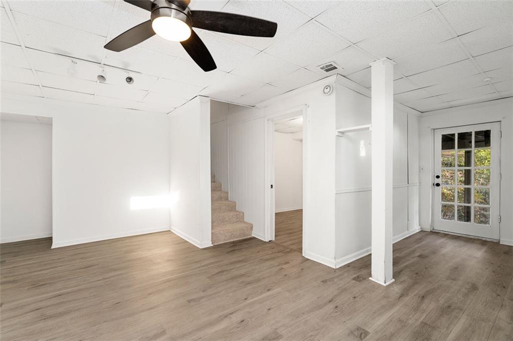 3059 Trafalgar Way Atlanta, GA 30341 - Photo 25 of 52 an empty room with wooden floor ceiling fan