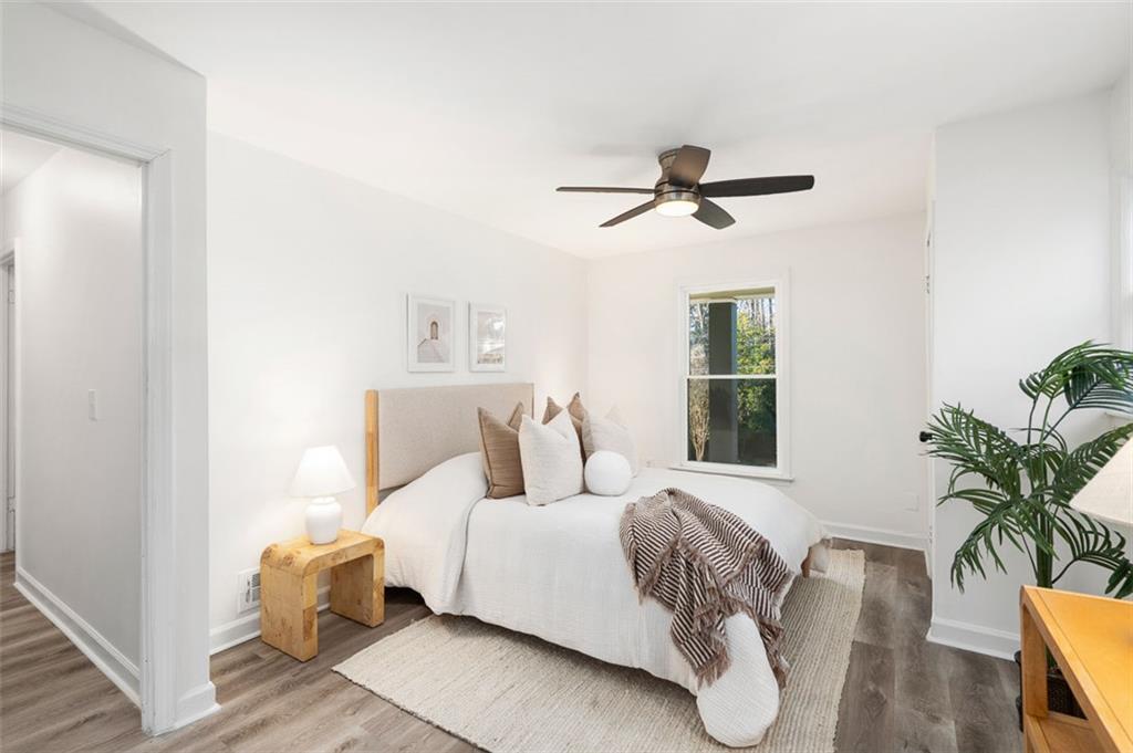 3059 Trafalgar Way Atlanta, GA 30341 - Photo 31 of 52 a bedroom with a bed and a potted plant