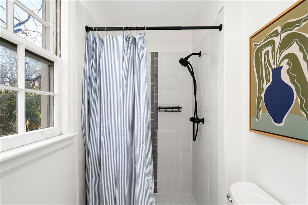 3059 Trafalgar Way Atlanta, GA 30341 - Photo 37 of 52 a bathroom with a shower curtain and a window
