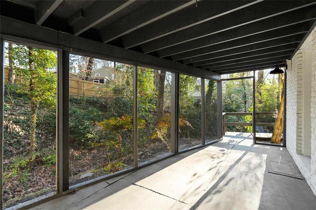 3059 Trafalgar Way Atlanta, GA 30341 - Photo 45 of 52 a porch with a table and chairs in front of a yard