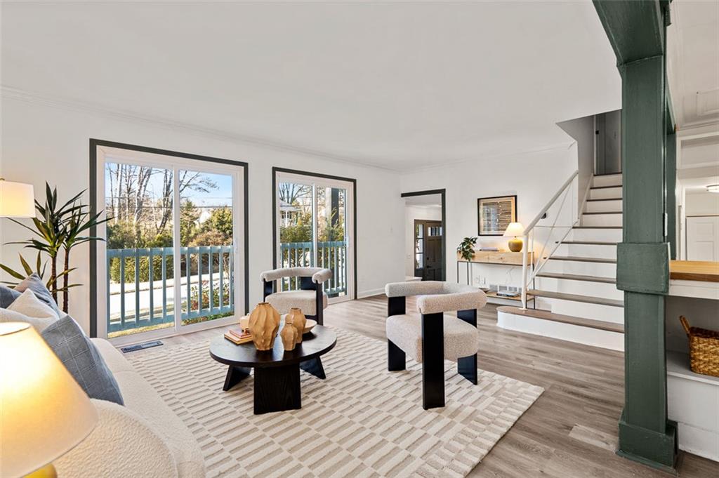 3059 Trafalgar Way Atlanta, GA 30341 - Photo 8 of 52 a living room with furniture and floor to ceiling windows