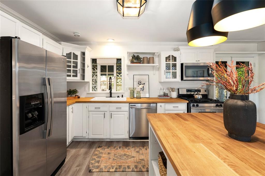 3059 Trafalgar Way Atlanta, GA 30341 - Photo 10 of 52 a large kitchen with stainless steel appliances granite countertop a refrigerator a stove and a sink