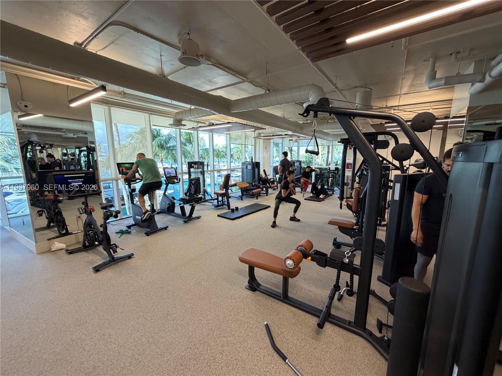 400 Alton Road, Unit LPH3007 Miami Beach, FL 33139 - Photo 36 of 51 a view of a room with gym equipment