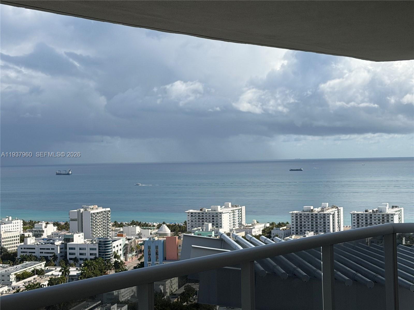 400 Alton Road, Unit LPH3007 Miami Beach, FL 33139 - Photo 44 of 51 a view of a balcony with an outdoor seating