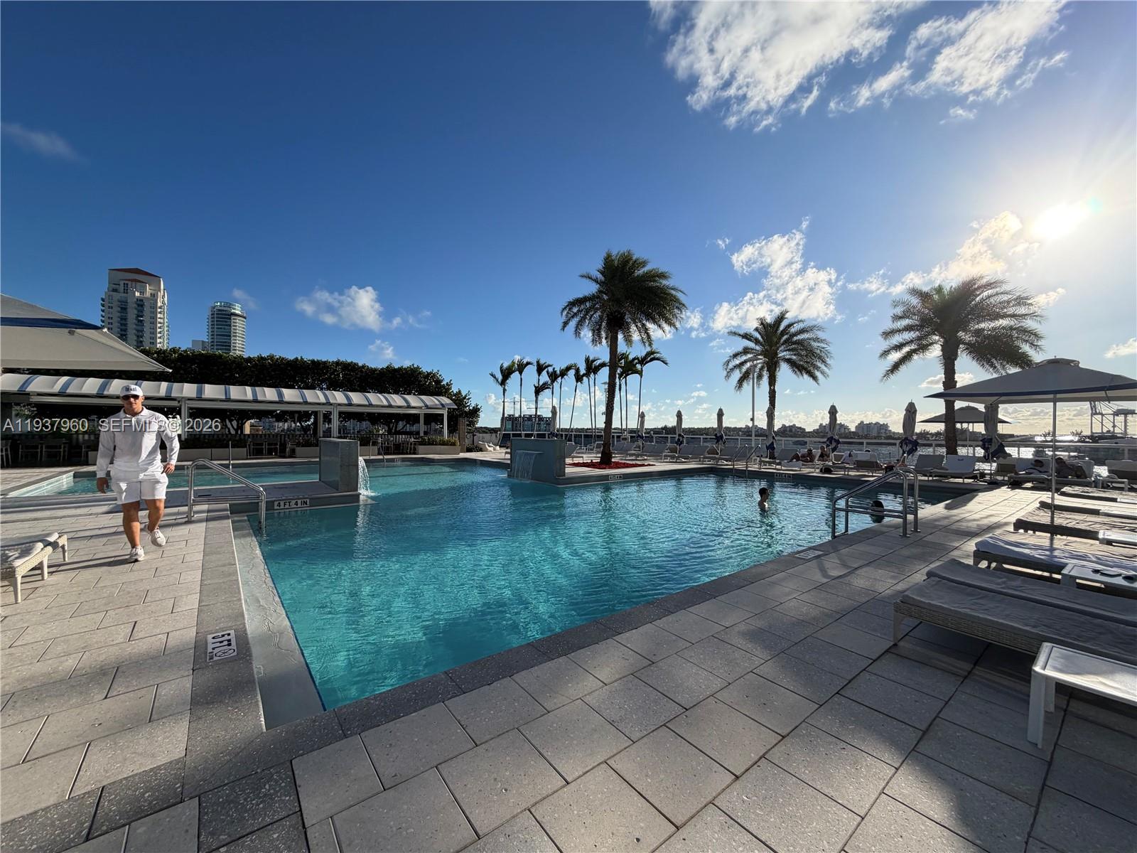 400 Alton Road, Unit LPH3007 Miami Beach, FL 33139 - Photo 50 of 51 a view of swimming pool with outdoor seating