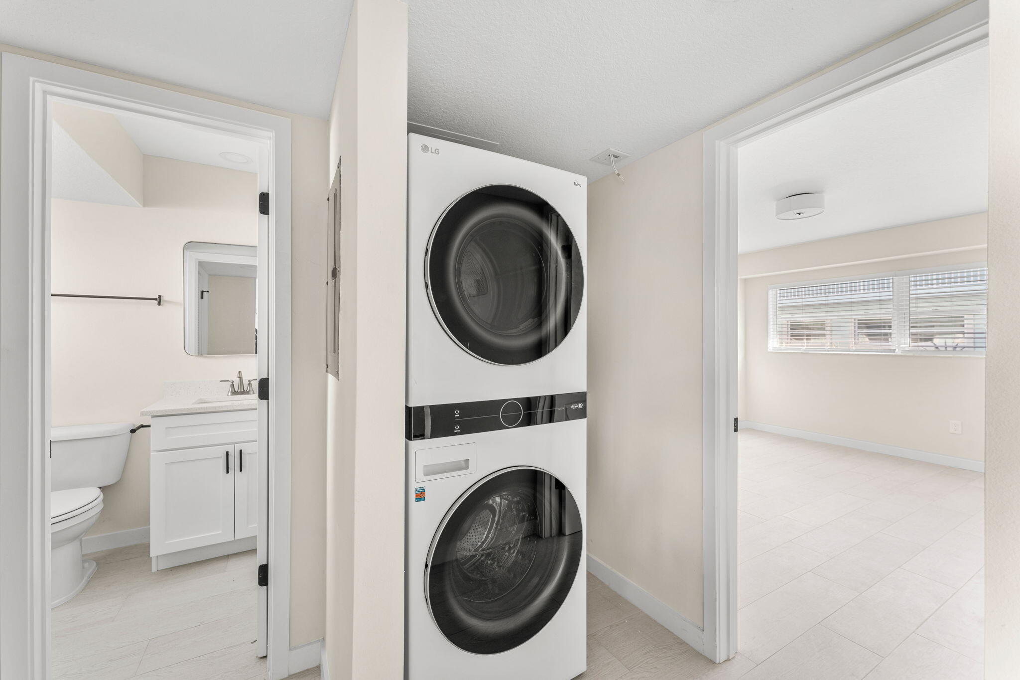 120 Central Road, Unit 209 Indian Harbour Beach, FL 32937 - Photo 7 of 12 a utility room with sink dryer and washer