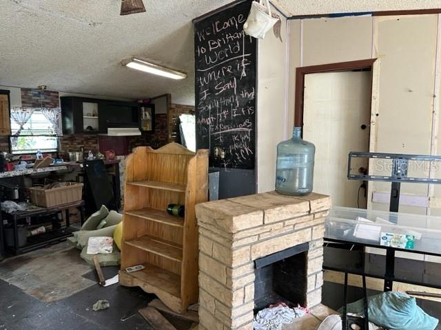 10207 East Pike Drive Inverness, FL 34450 - Photo 8 of 13 a kitchen with a refrigerator and a stove top oven