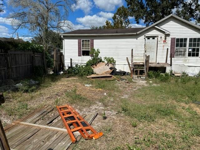 10207 East Pike Drive Inverness, FL 34450 - Photo 9 of 13 a view of a small house with a yard