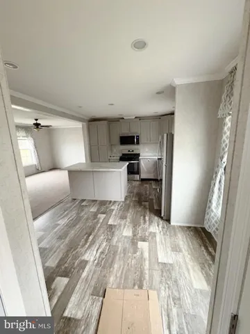 a stove top oven sitting inside of a kitchen