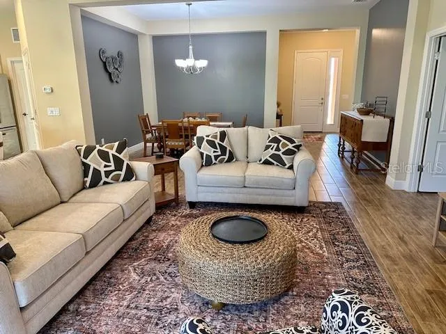 a living room with furniture a rug and a rug