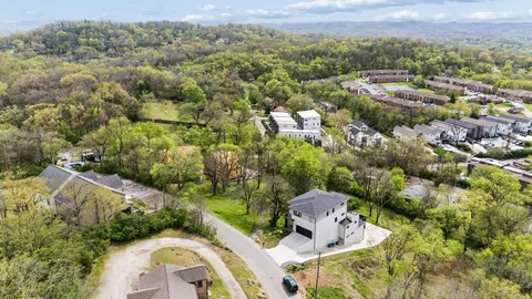 an aerial view of residential house with outdoor space