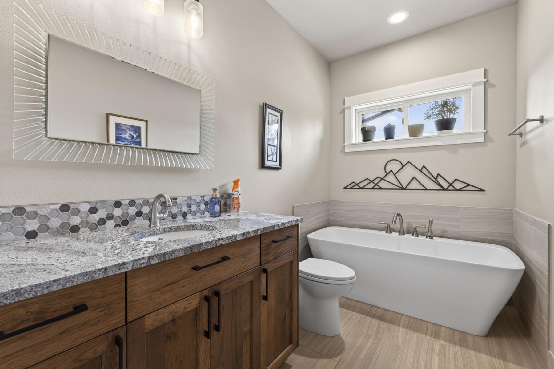 11620 Southwest Pixie Lane Culver, OR 97734 - Photo 29 of 53 a bathroom with a granite countertop sink and a mirror