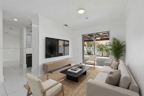 a living room with furniture and a flat screen tv