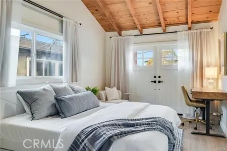 a bedroom with a bed and a table in it