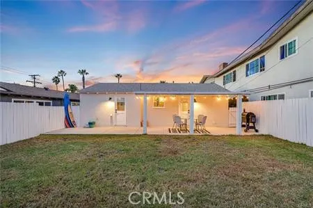a big room with an ocean view and a floor to ceiling window