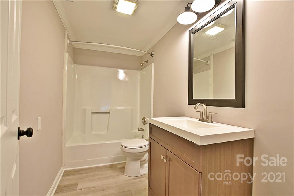 2441 State Rd S-29-305 Lancaster, SC 29720 - Photo 14 of 29 a bathroom with a sink toilet and shower