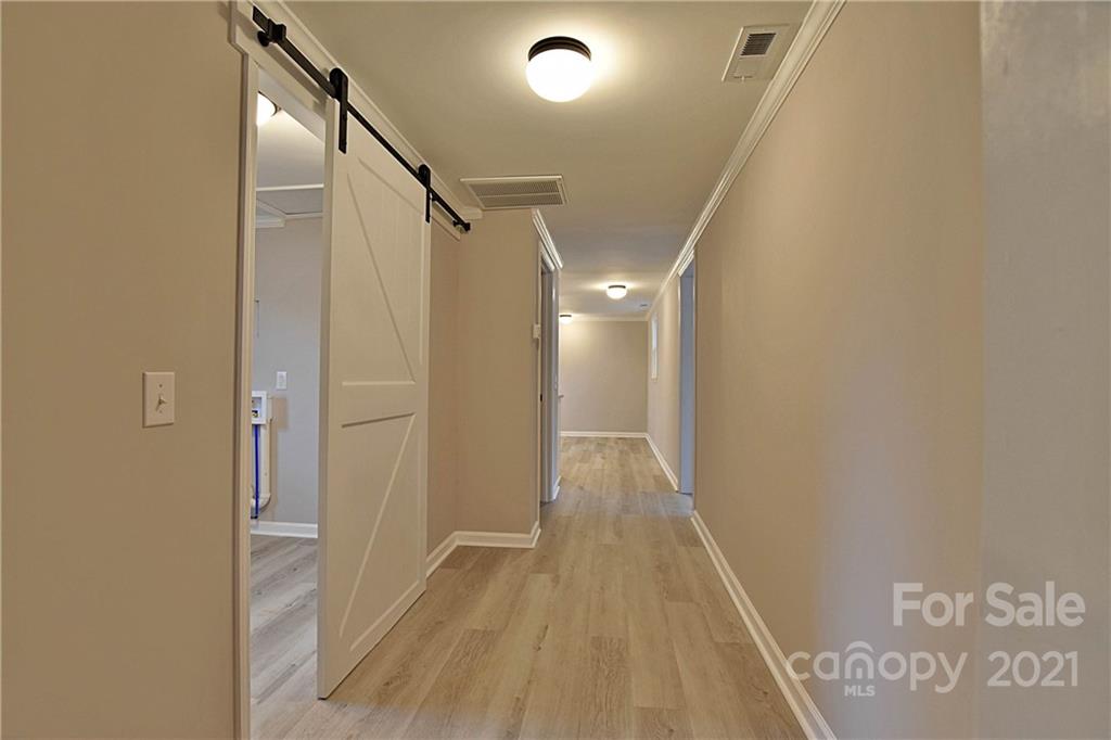 2441 State Rd S-29-305 Lancaster, SC 29720 - Photo 19 of 29 a view of hallway with wooden floor