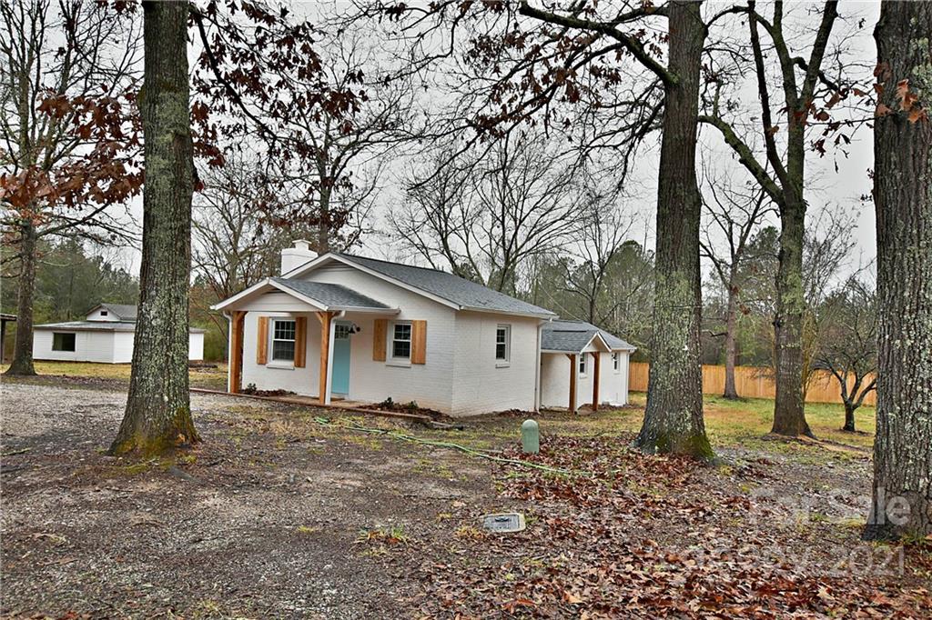 2441 State Rd S-29-305 Lancaster, SC 29720 - Photo 3 of 29 a white house that has a tree in front of it
