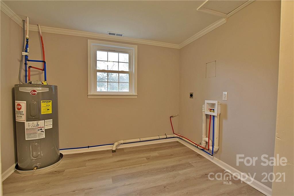 2441 State Rd S-29-305 Lancaster, SC 29720 - Photo 21 of 29 a view of an empty room with wooden floor and a window