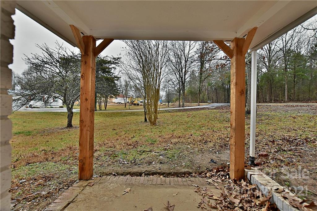 2441 State Rd S-29-305 Lancaster, SC 29720 - Photo 22 of 29 a view of a yard with large trees