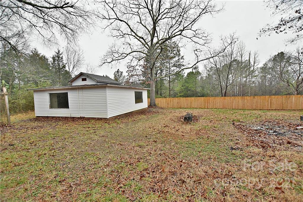 2441 State Rd S-29-305 Lancaster, SC 29720 - Photo 23 of 29 a backyard of a house with lots of green space