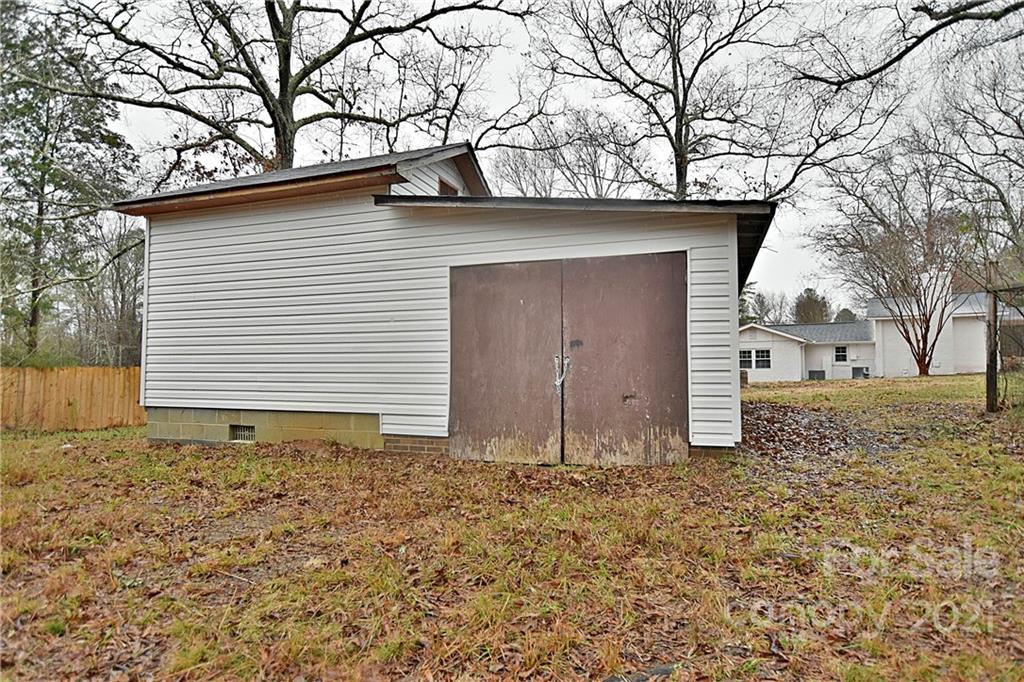 2441 State Rd S-29-305 Lancaster, SC 29720 - Photo 24 of 29 a small white house with a outdoor space