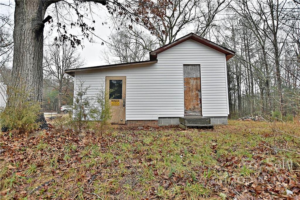 2441 State Rd S-29-305 Lancaster, SC 29720 - Photo 25 of 29 a front view of a house with a yard