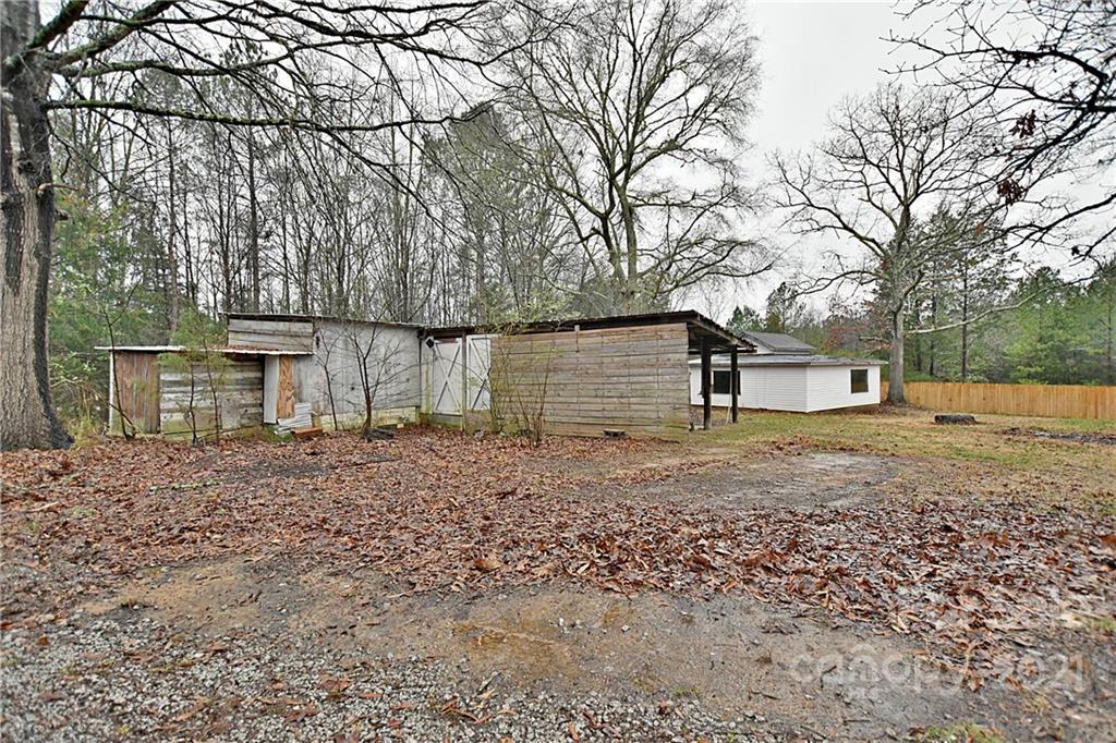2441 State Rd S-29-305 Lancaster, SC 29720 - Photo 26 of 29 a view of a backyard with large trees