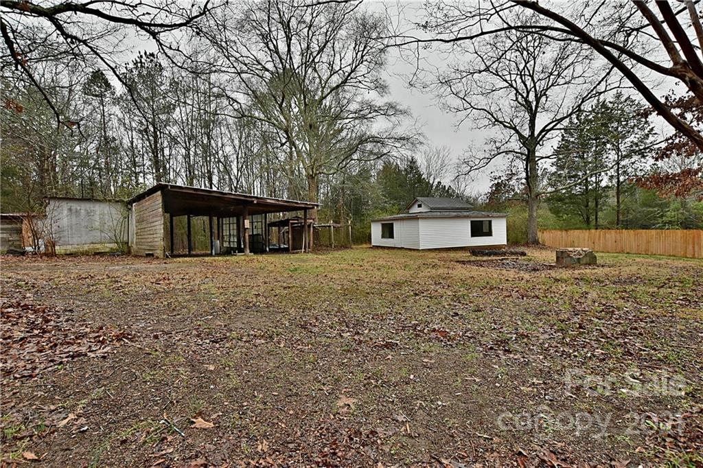 2441 State Rd S-29-305 Lancaster, SC 29720 - Photo 28 of 29 a house with trees in front of it