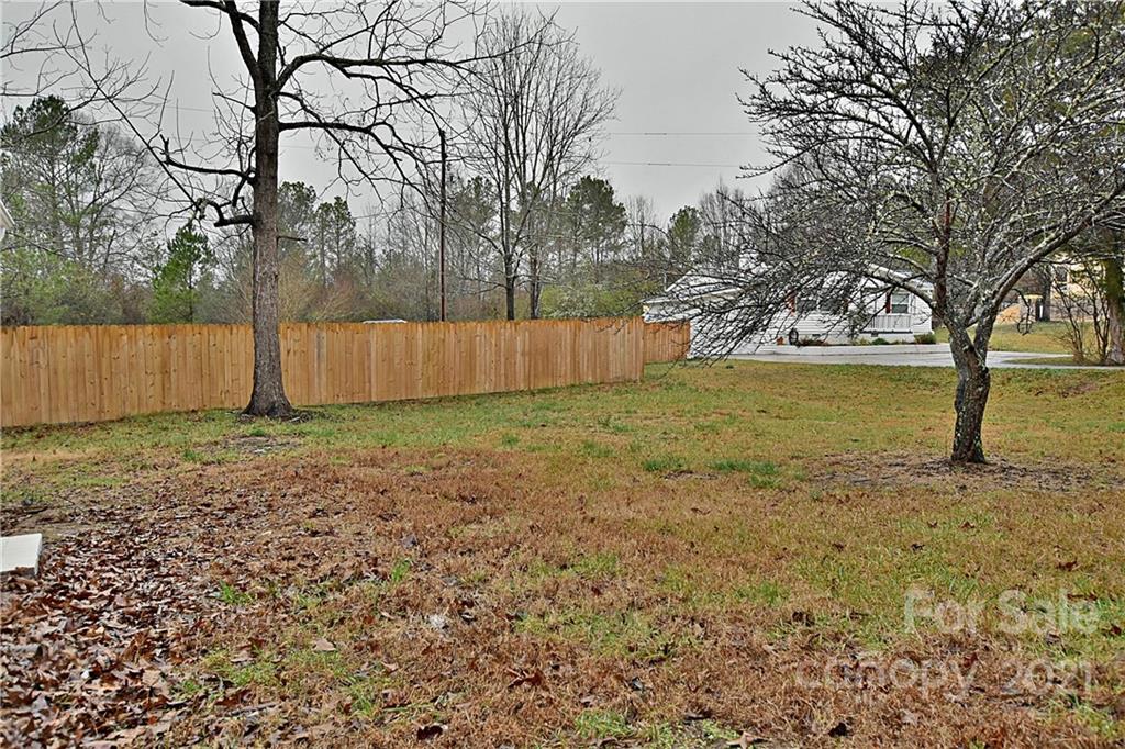 2441 State Rd S-29-305 Lancaster, SC 29720 - Photo 29 of 29 a view of a yard with a tree