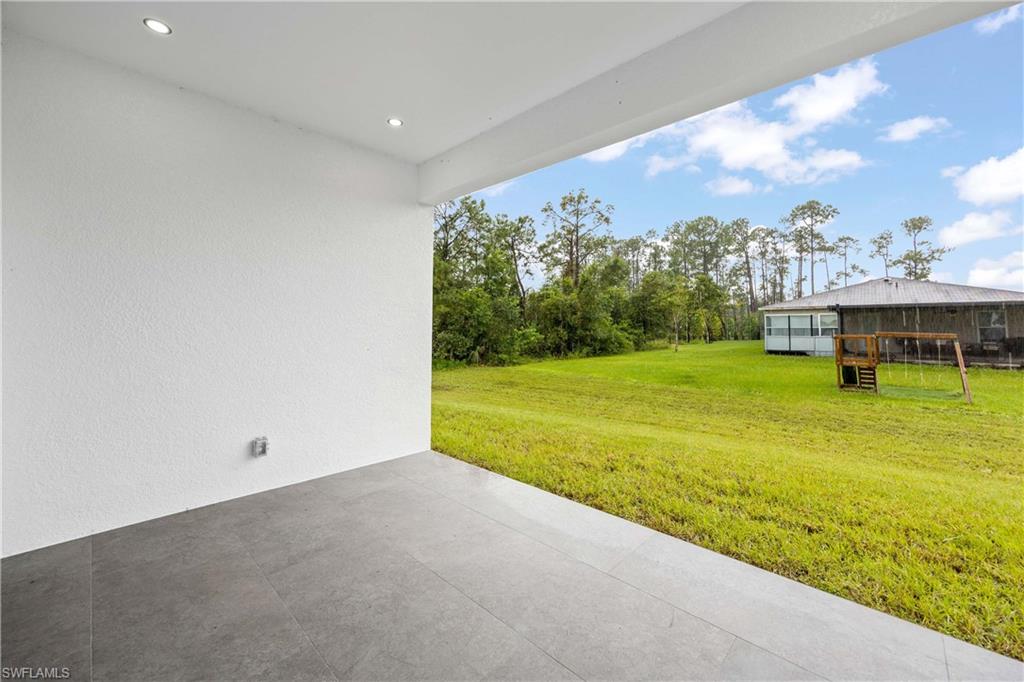 3908 Sunset Road Lehigh Acres, FL 33971 - Photo 27 of 30 a view of an ocean with a big yard