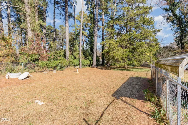 a view of a house with a yard covered in snow