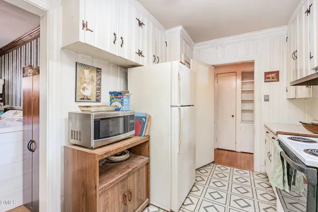 a kitchen with stainless steel appliances a refrigerator a stove and a sink