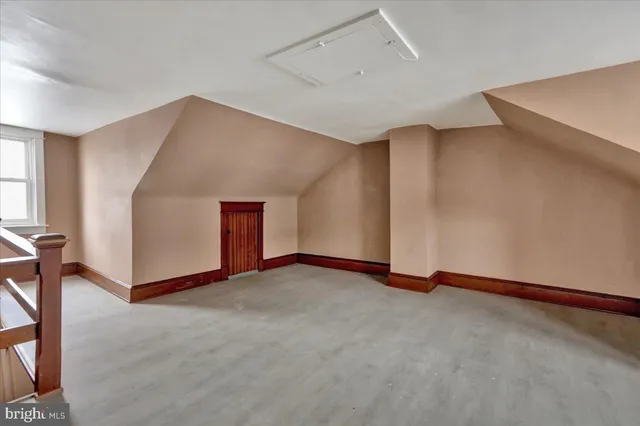 a kitchen with granite countertop cabinets stainless steel appliances a sink and a window