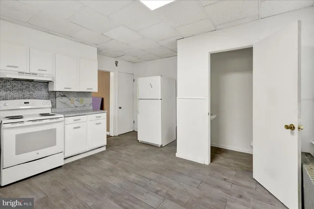 a bathroom with a sink and shower